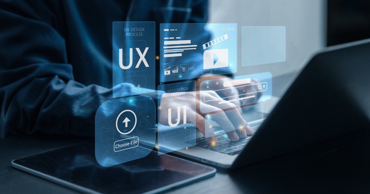 Hands typing on a laptop with floating UX and UI design icons, representing thoughtful web design.